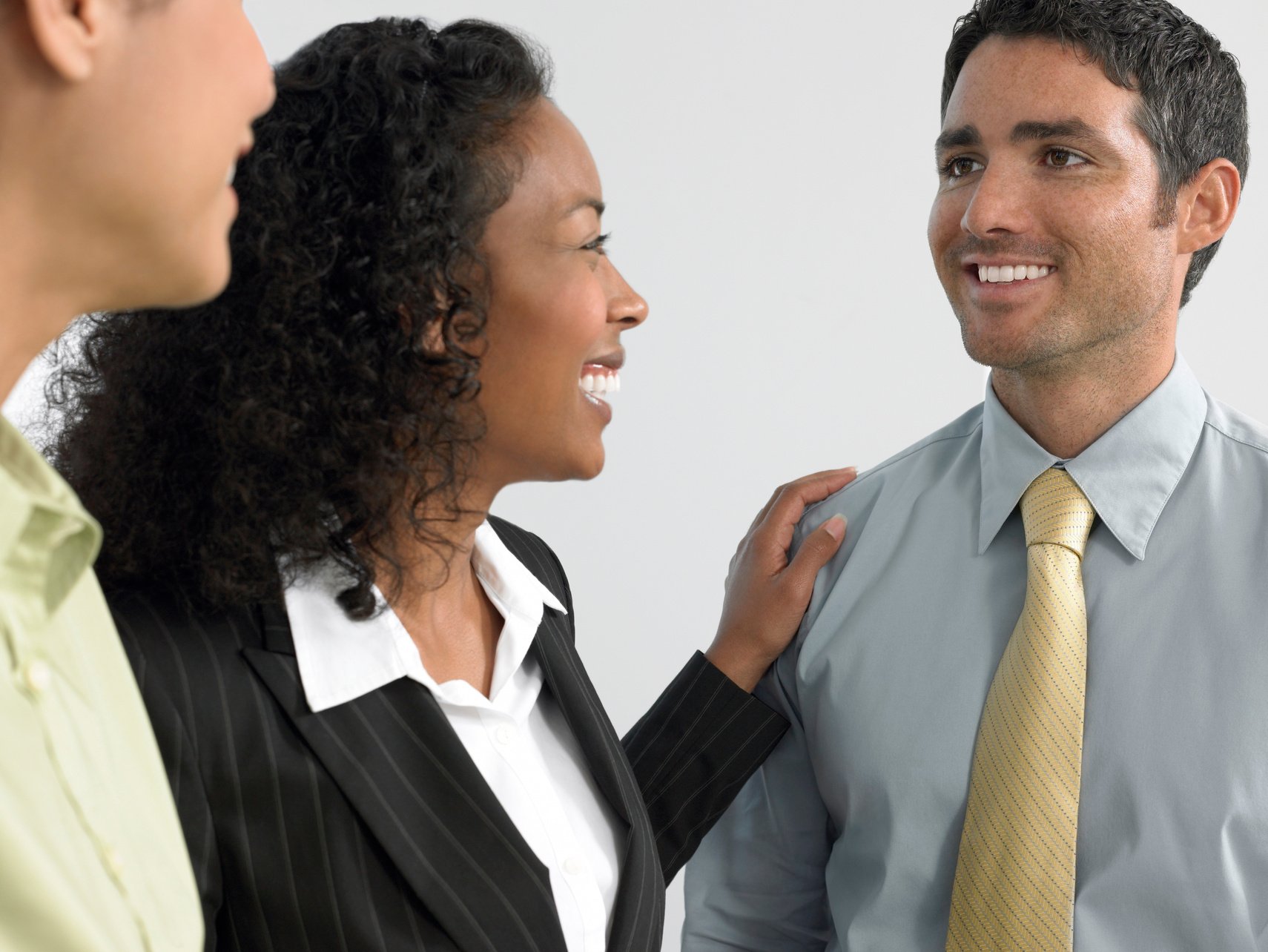 Man with colleagues hand on shoulder